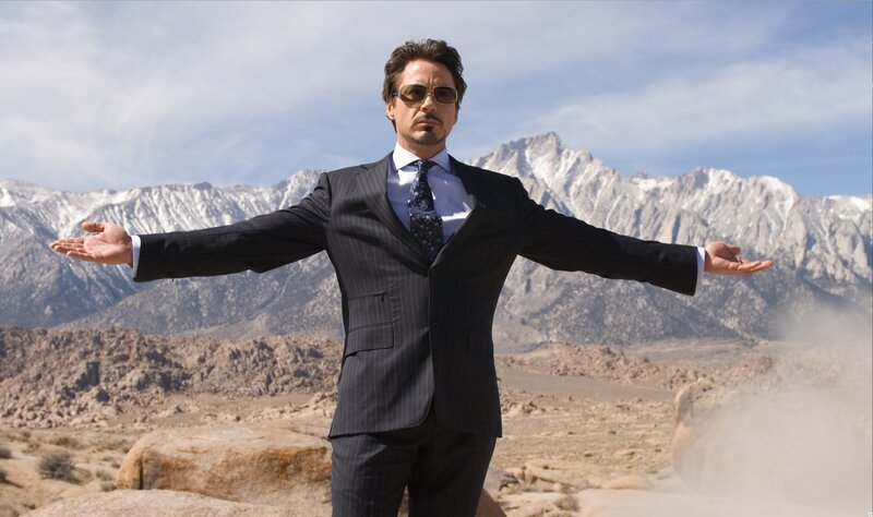 Man in Suit with Arms Outstretched — Blue, Dramatic, Afternoon