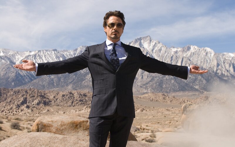 Man in Suit with Arms Outstretched — Gray
