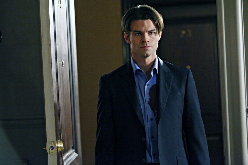 Man in Suit with Bloodstain