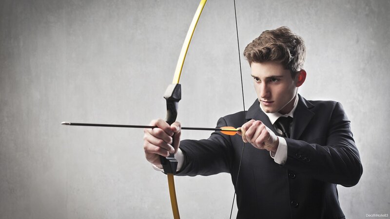 man in suit with bow and arrow