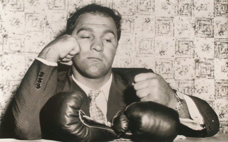 Man in suit with boxing gloves