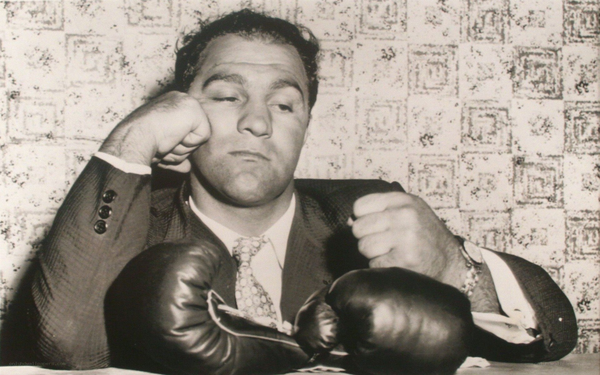 Man in suit with boxing gloves