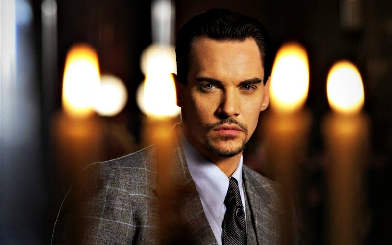 Man in Suit with Candles