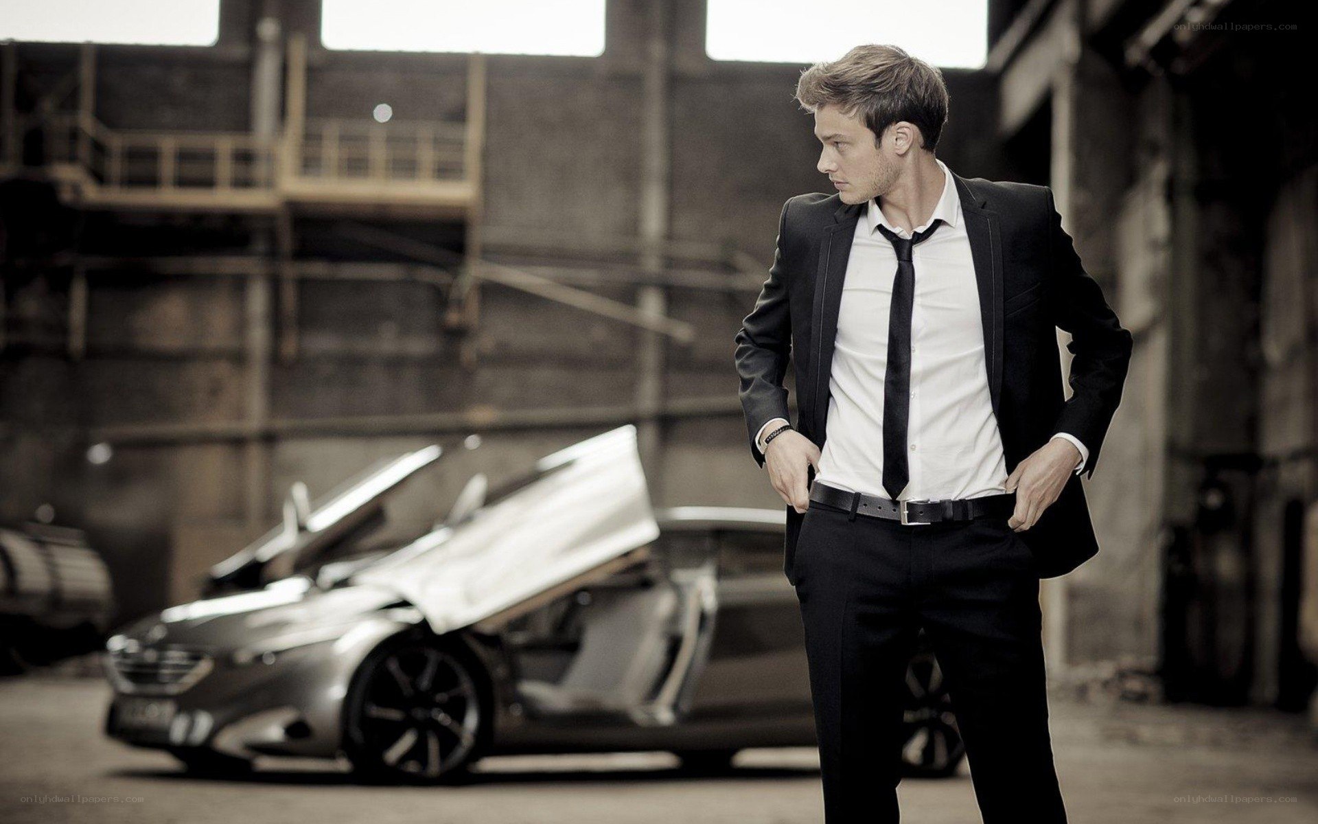 man in suit with car