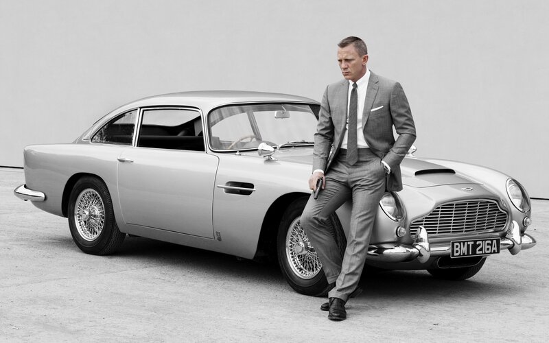 Man in Suit with Car — Gray, Serious, Photograph