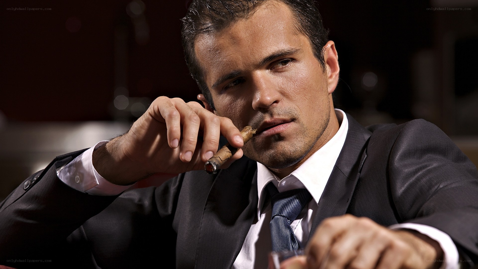 man in suit with cigar