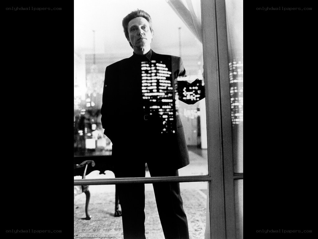 Man in suit with city lights reflection
