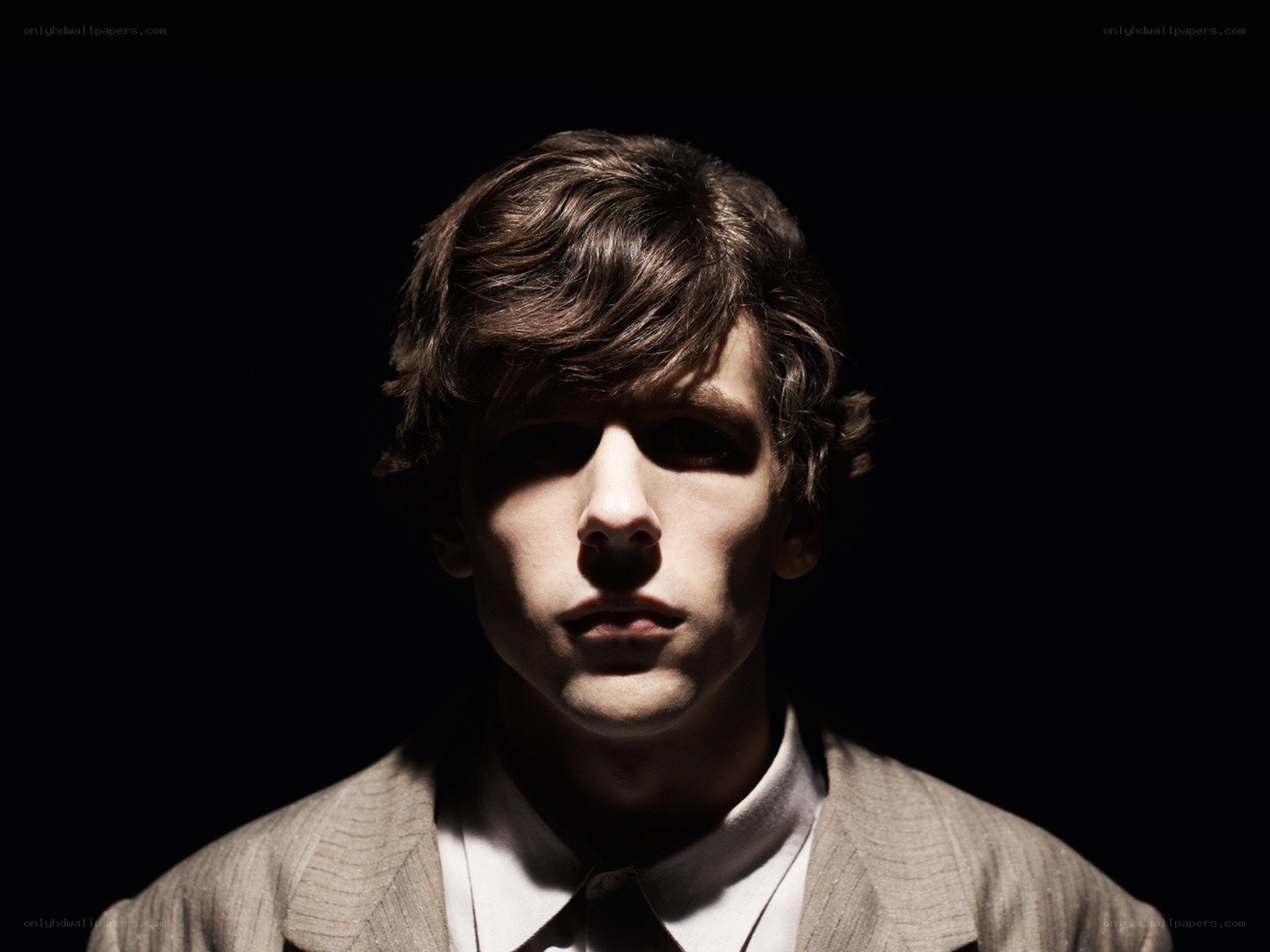 man in suit with dramatic lighting