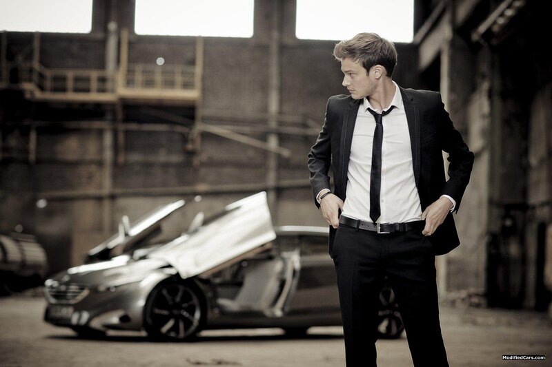 Man in suit with futuristic car