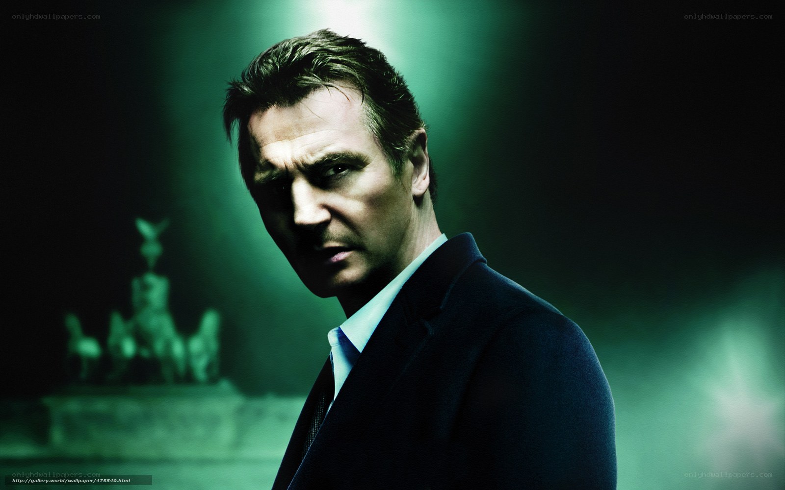 Man in suit with green lighting