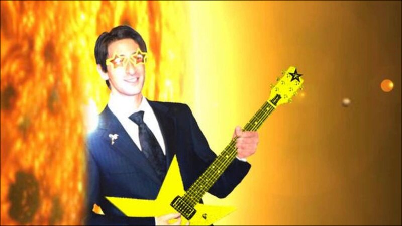 Man in Suit with Guitar