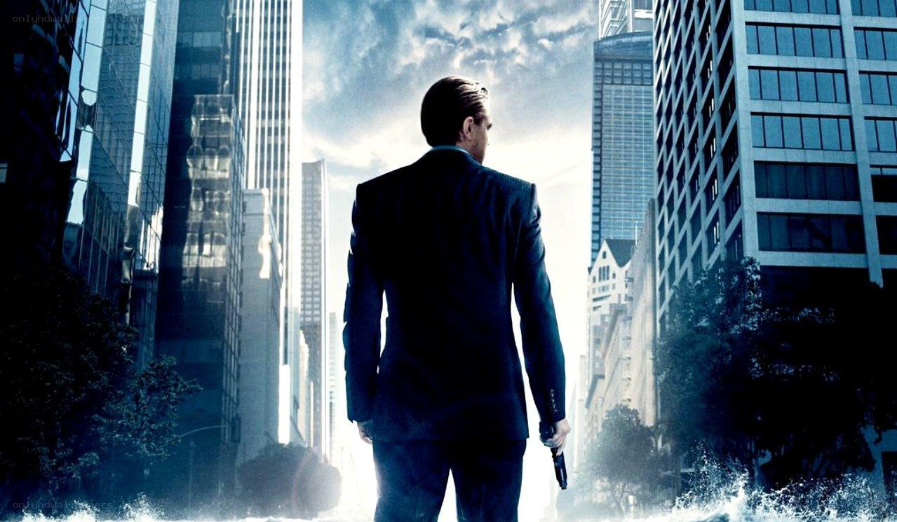 Man in suit with gun