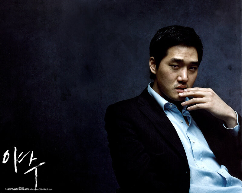 man in suit with hand on chin