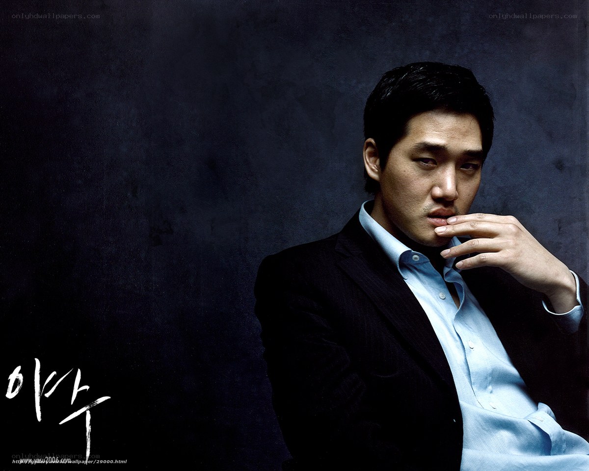 man in suit with hand on chin