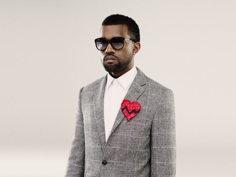 man in suit with heart pin