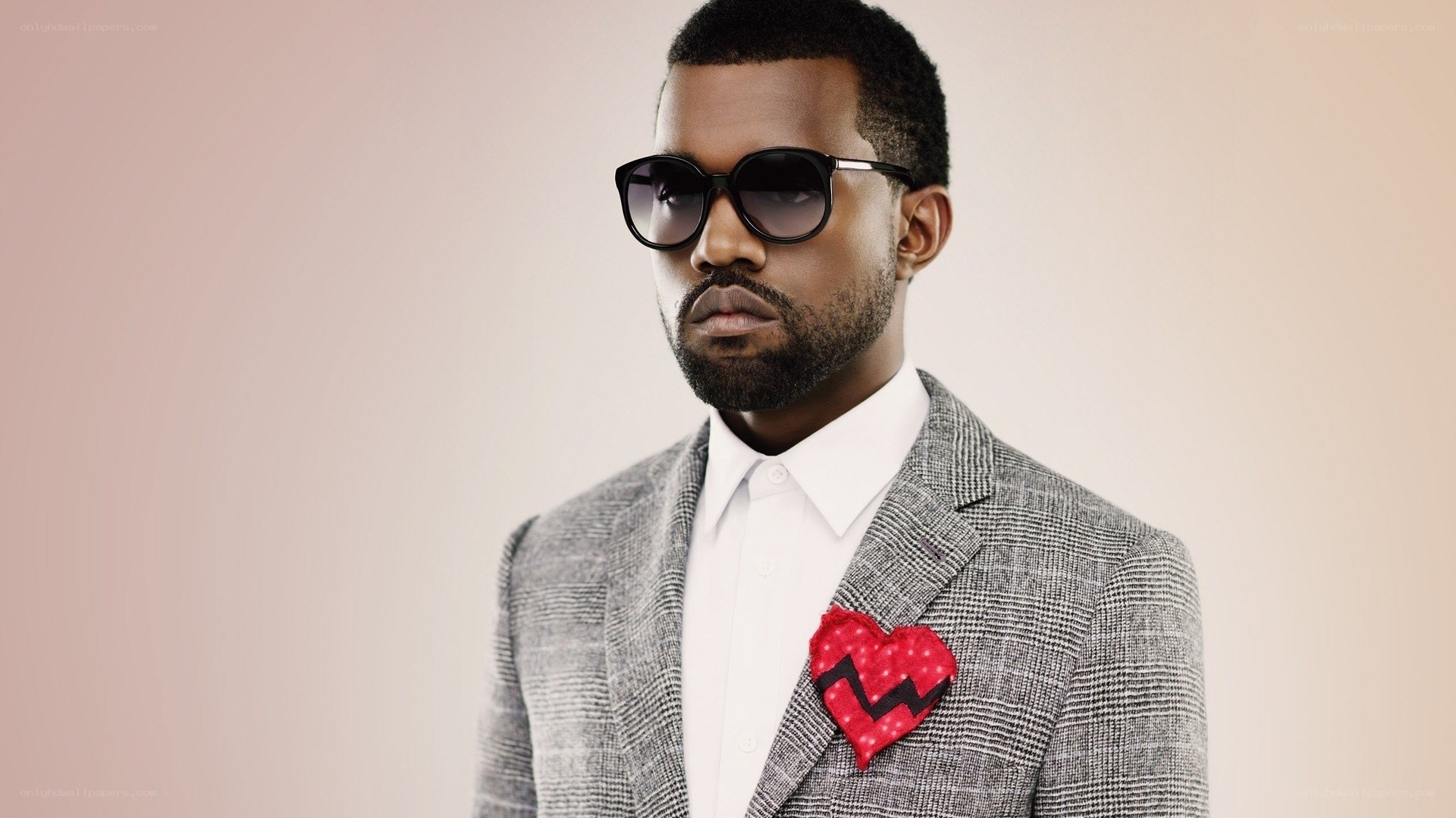 man in suit with heart pin