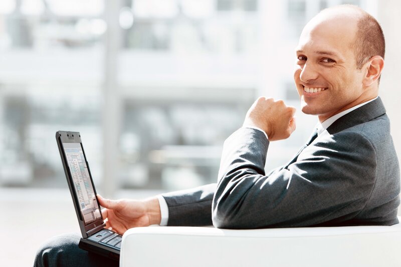 Man in Suit with Laptop