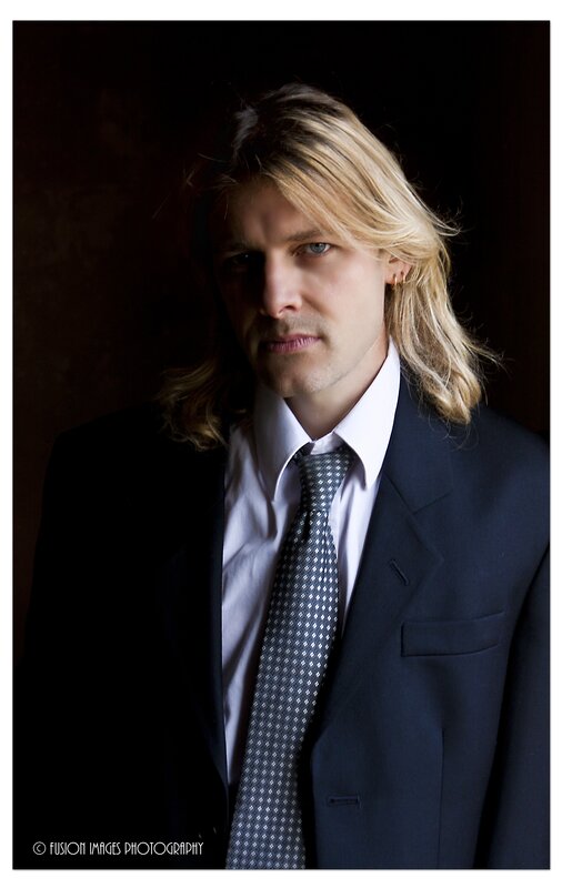 man in suit with long hair