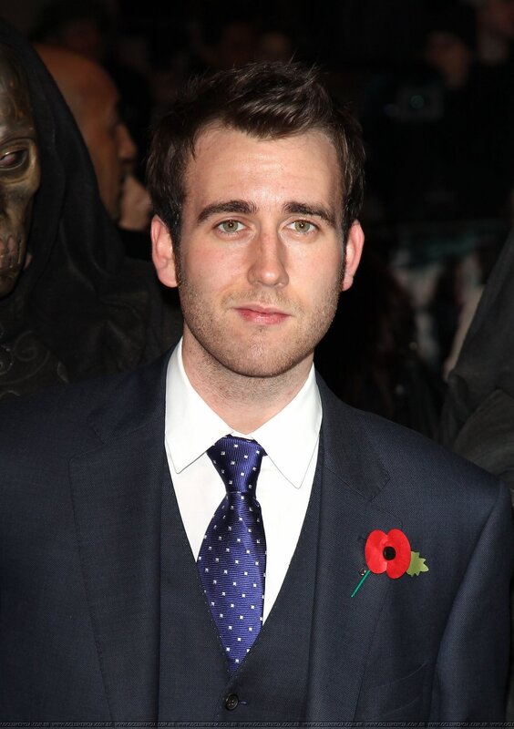 man in suit with poppy