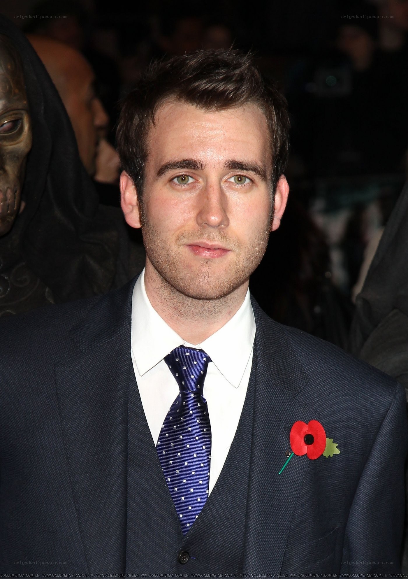 man in suit with poppy