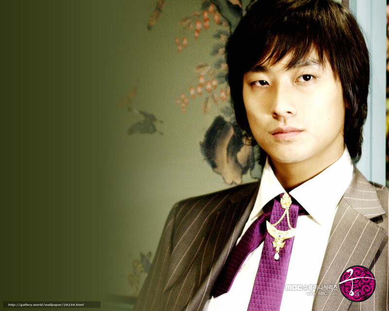 man in suit with purple tie
