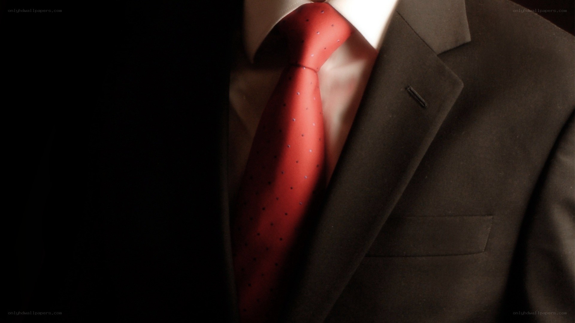 man in suit with red tie
