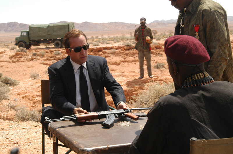 Man in Suit with Rifle
