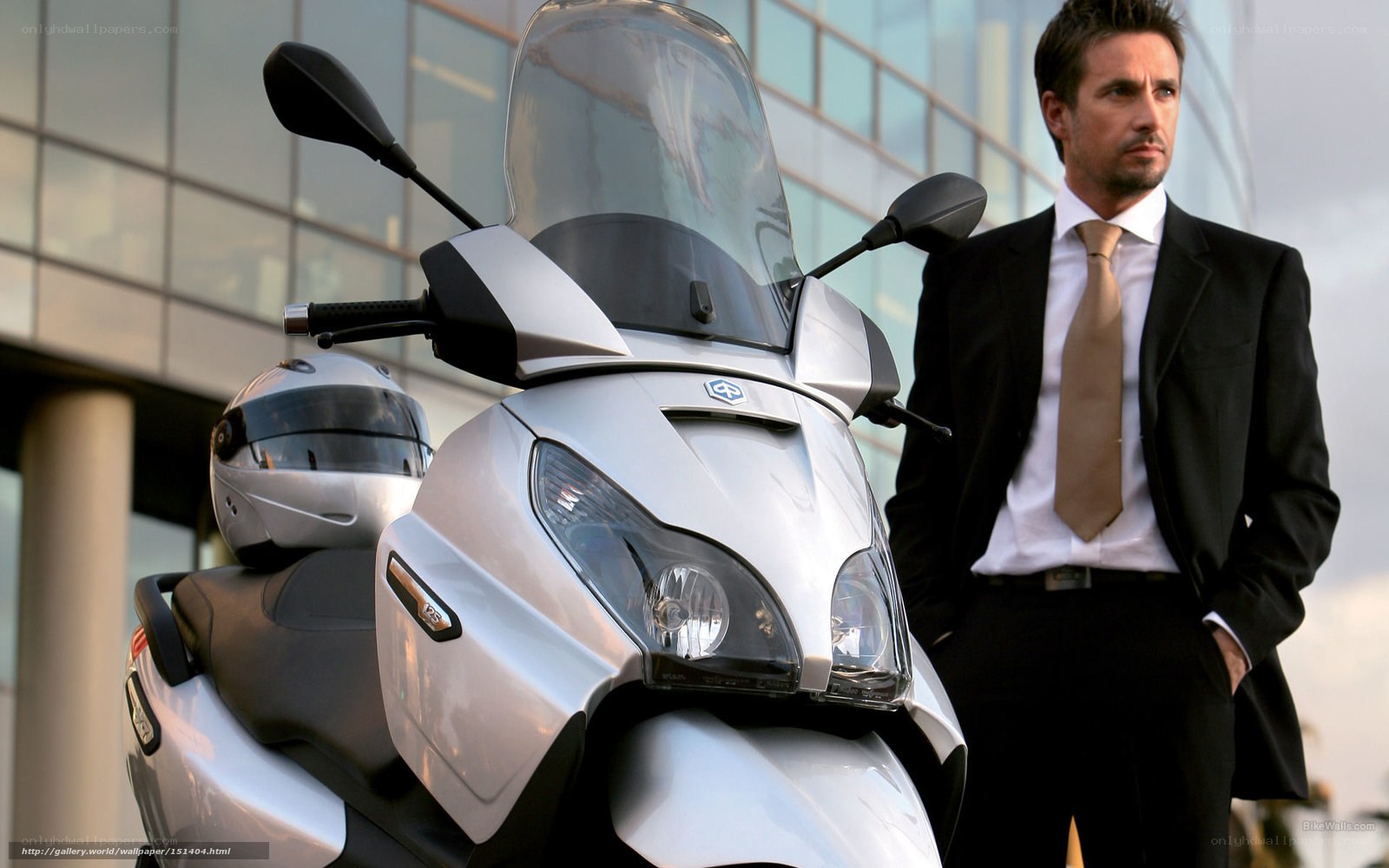 Man in suit with scooter