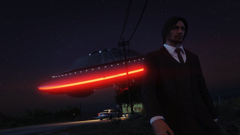 Man in Suit with UFO