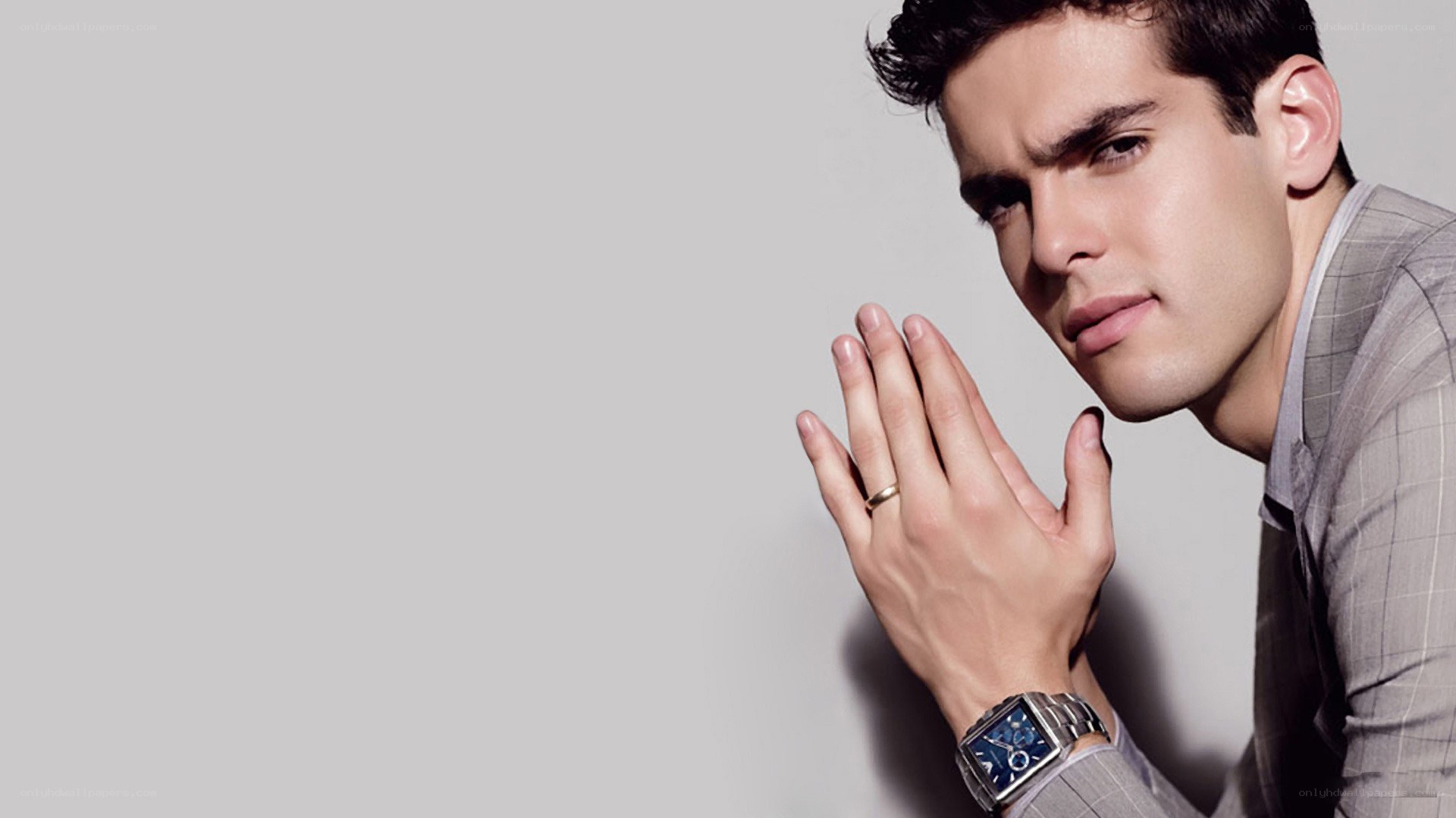 man in suit with watch