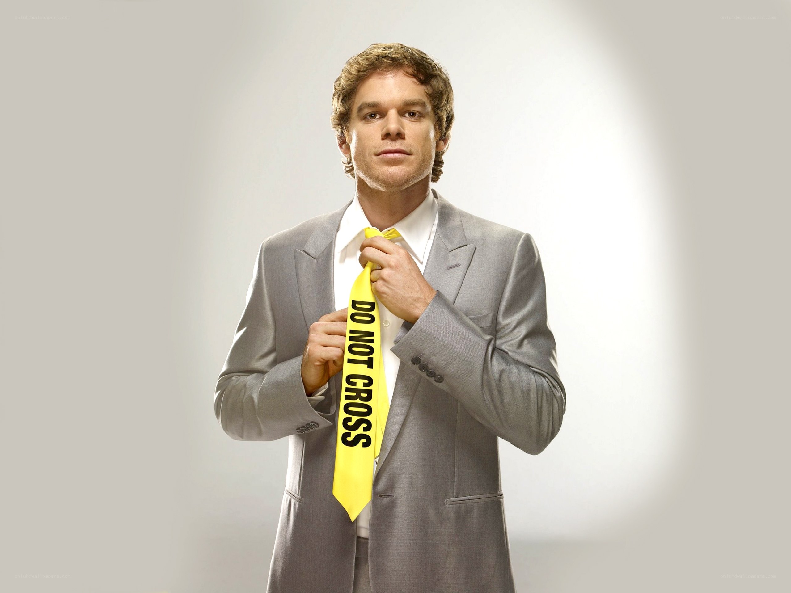 Man in suit with yellow tie