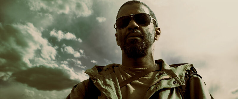 man in sunglasses against cloudy sky