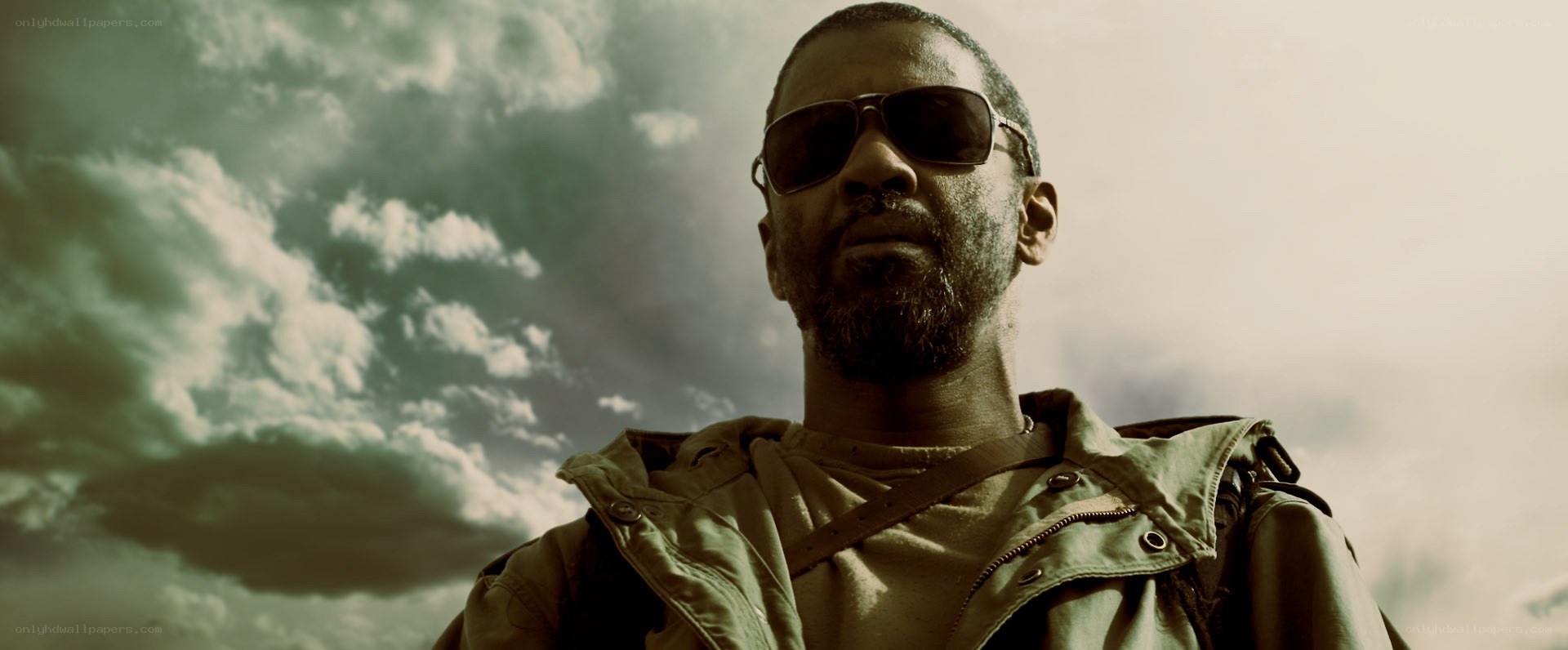 man in sunglasses against cloudy sky