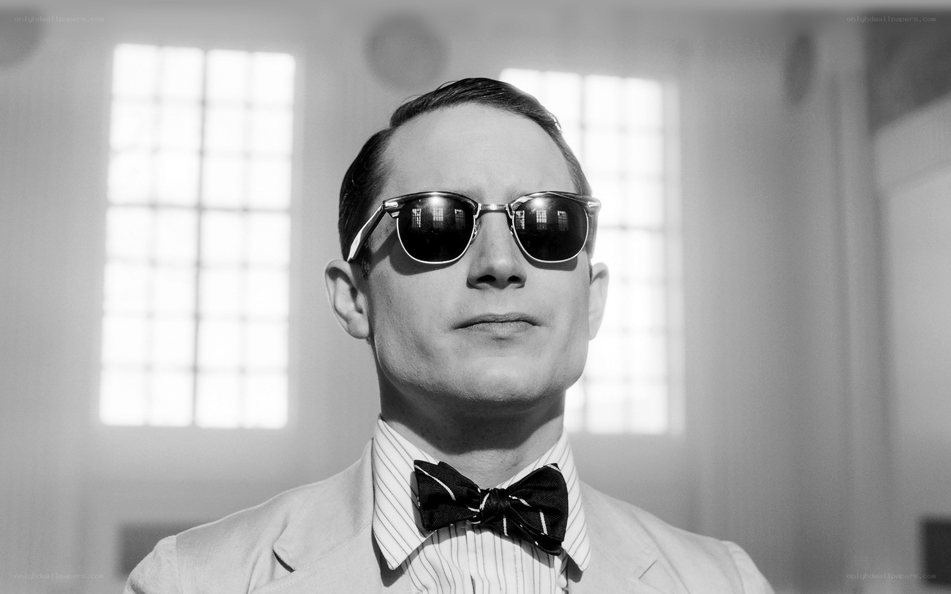 man in sunglasses and bow tie