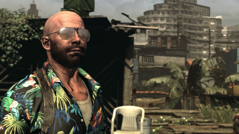 man in sunglasses and floral shirt