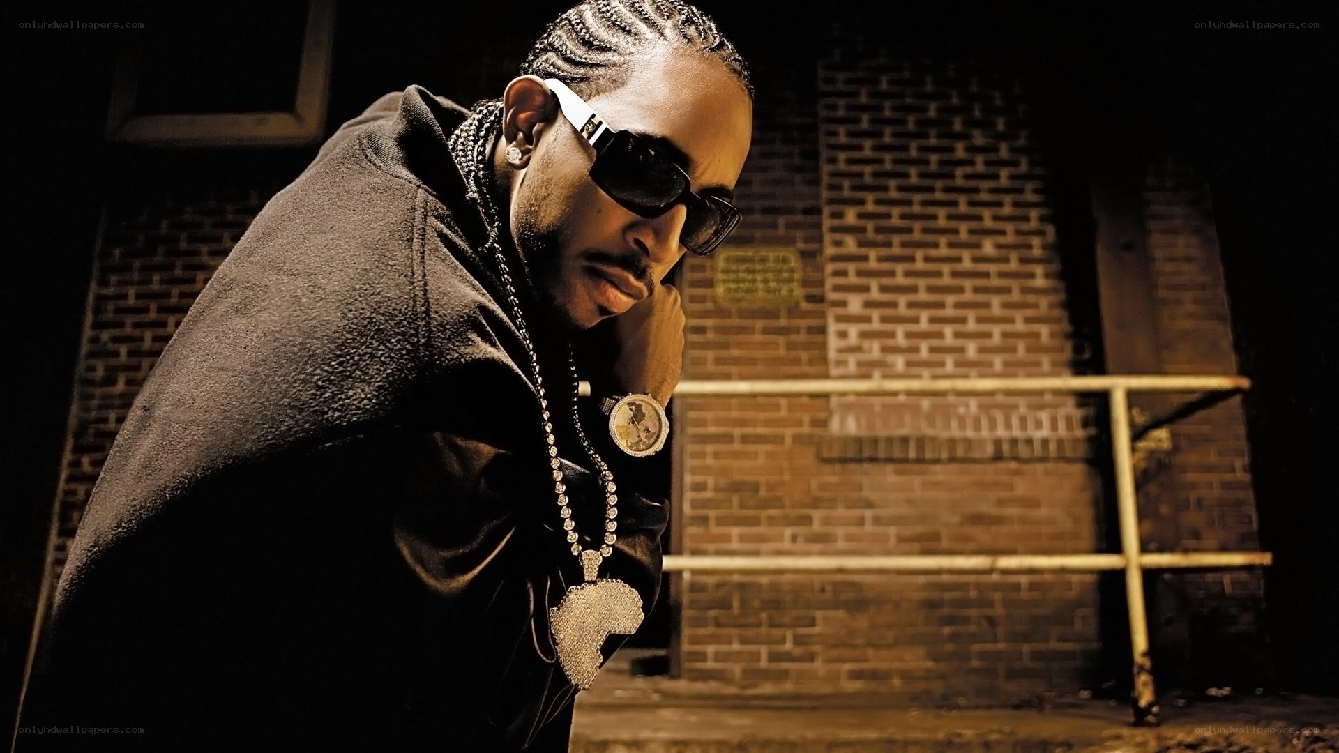 man in sunglasses and hoodie