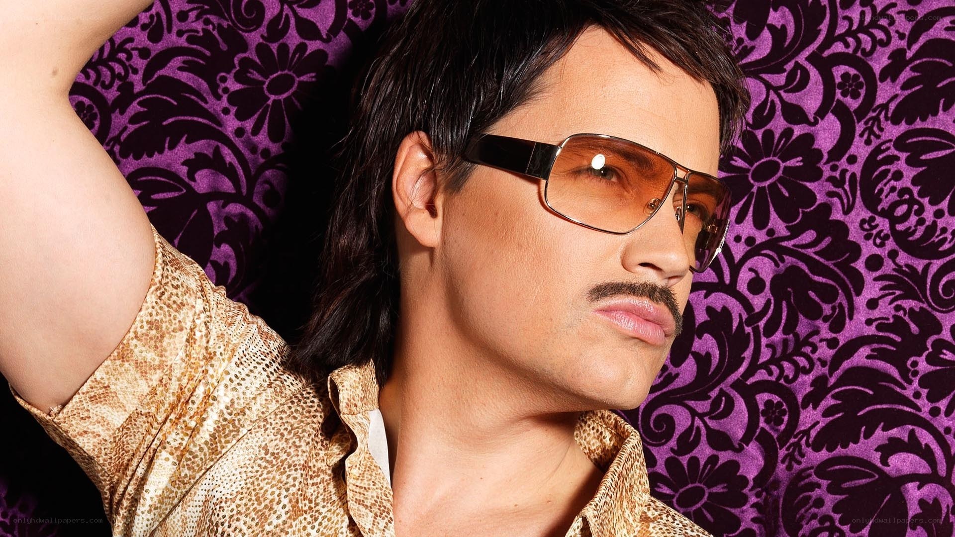 man in sunglasses and patterned shirt