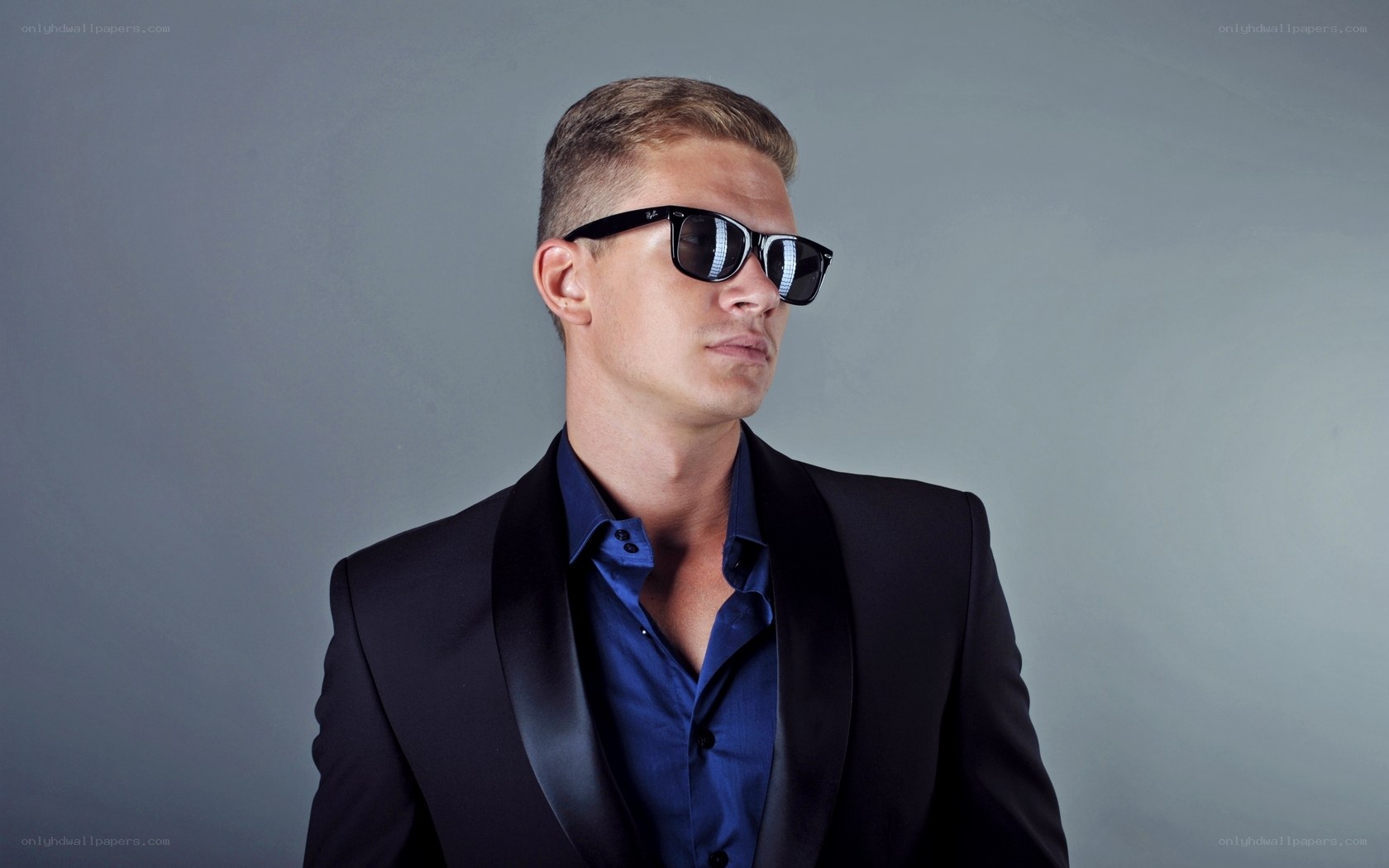 man in sunglasses and suit