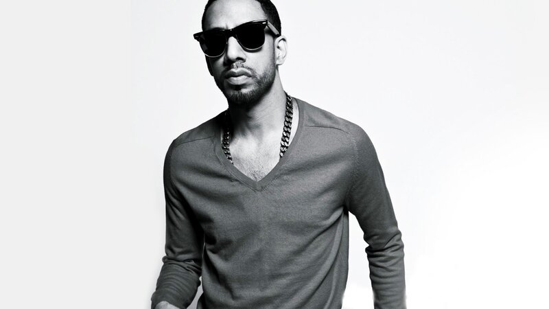 man in sunglasses and v-neck sweater