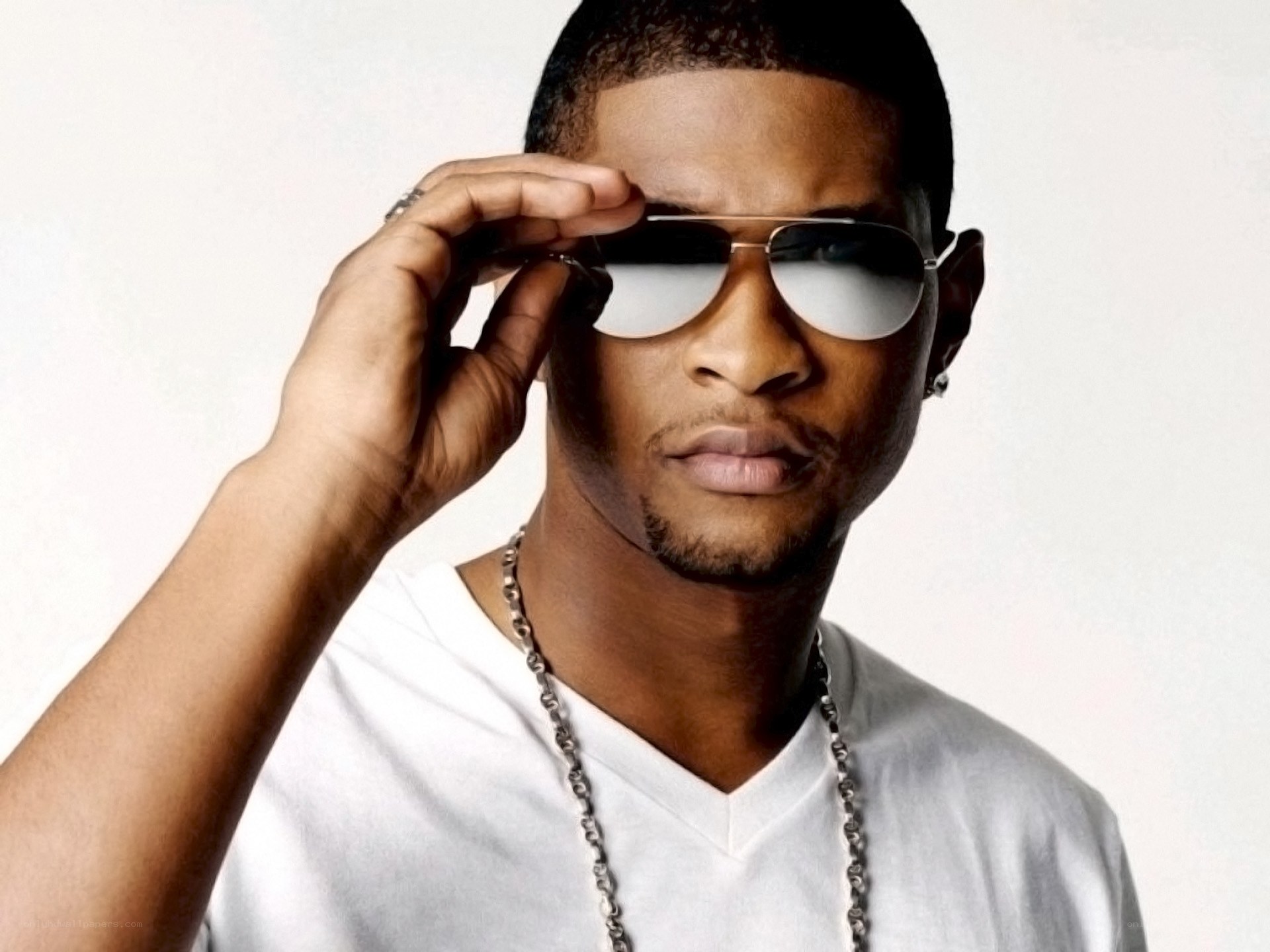 man in sunglasses and white shirt