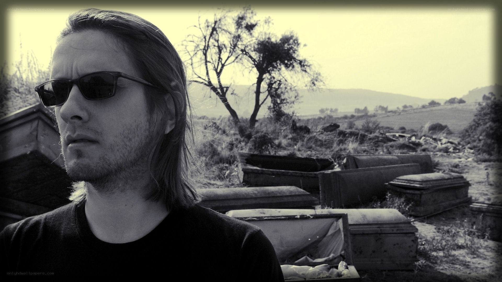 man in sunglasses at cemetery