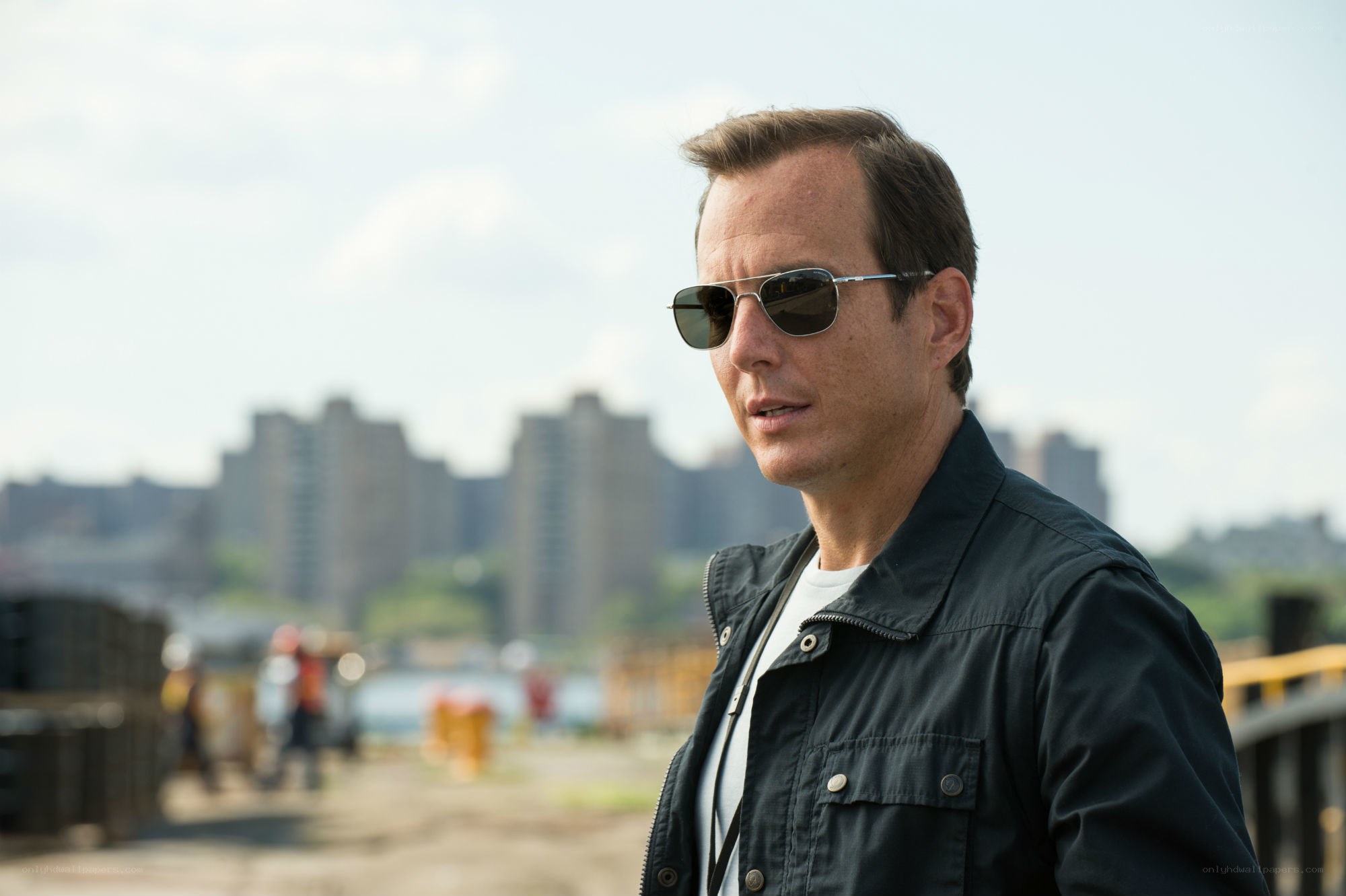 Man in sunglasses at waterfront