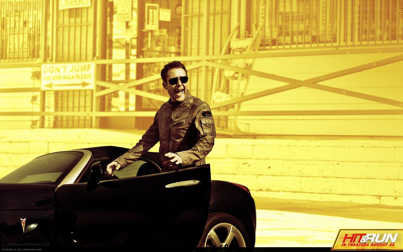 man in sunglasses by car