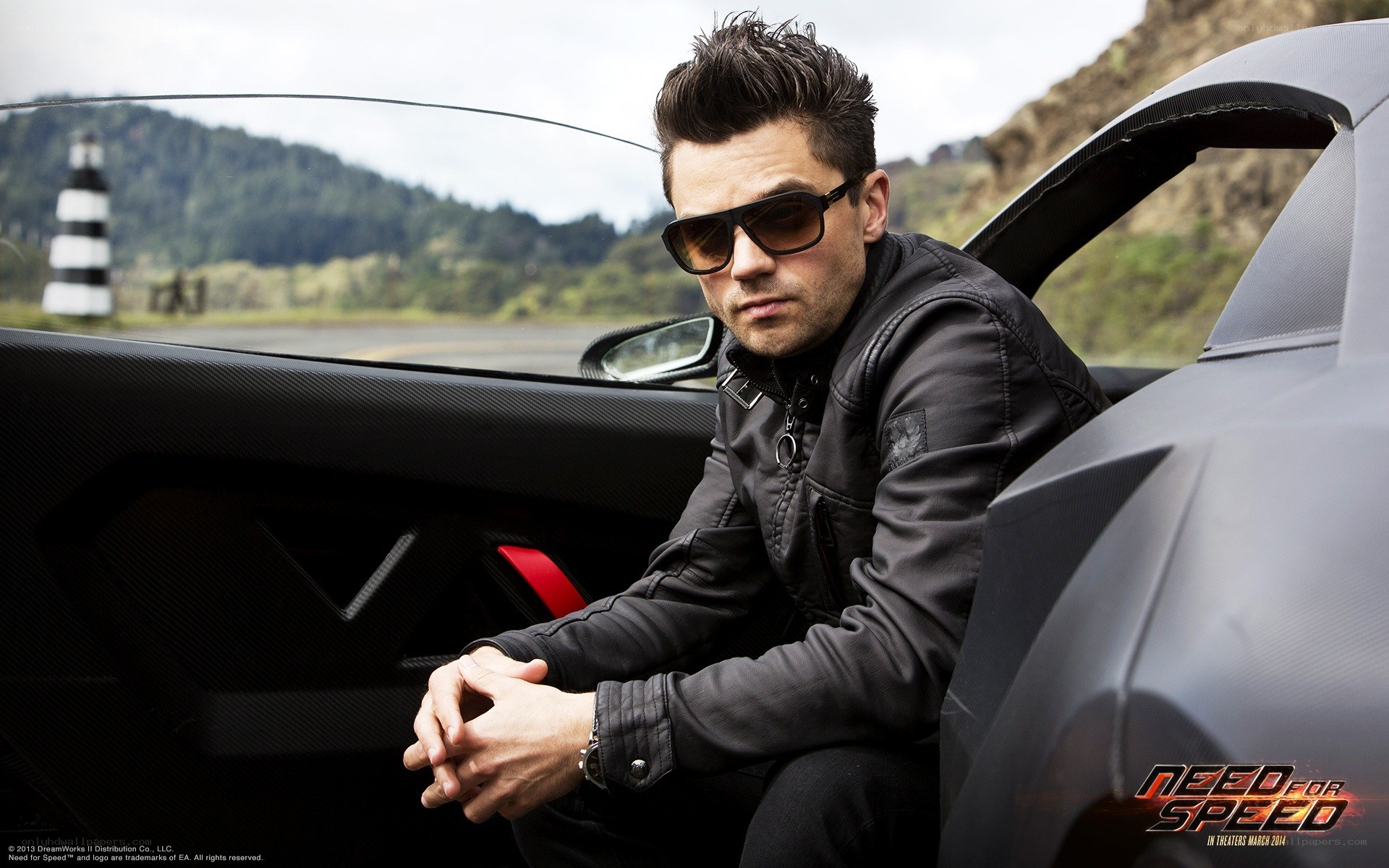 man in sunglasses by car