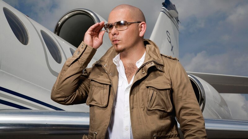 Man in sunglasses by private jet