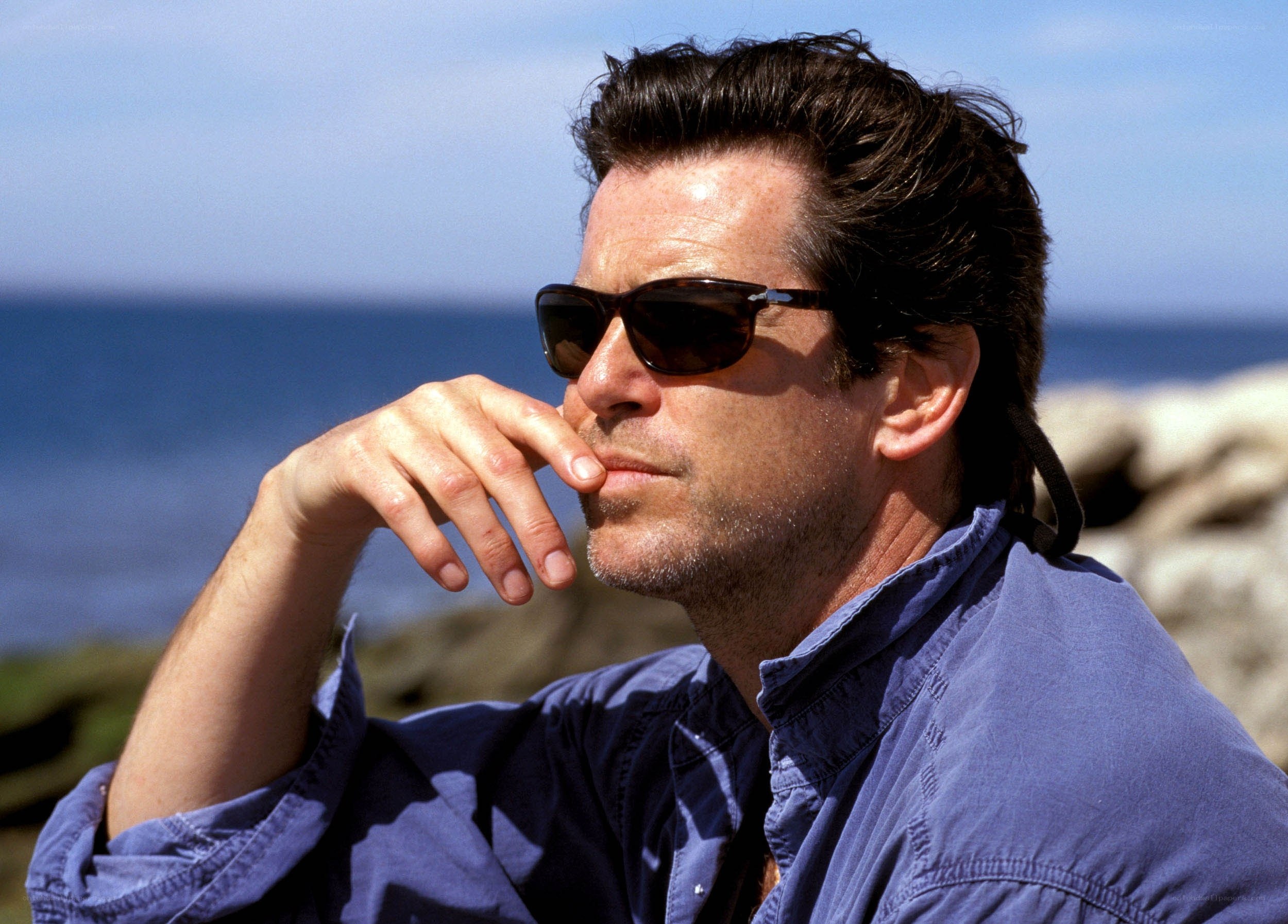 man in sunglasses by the sea