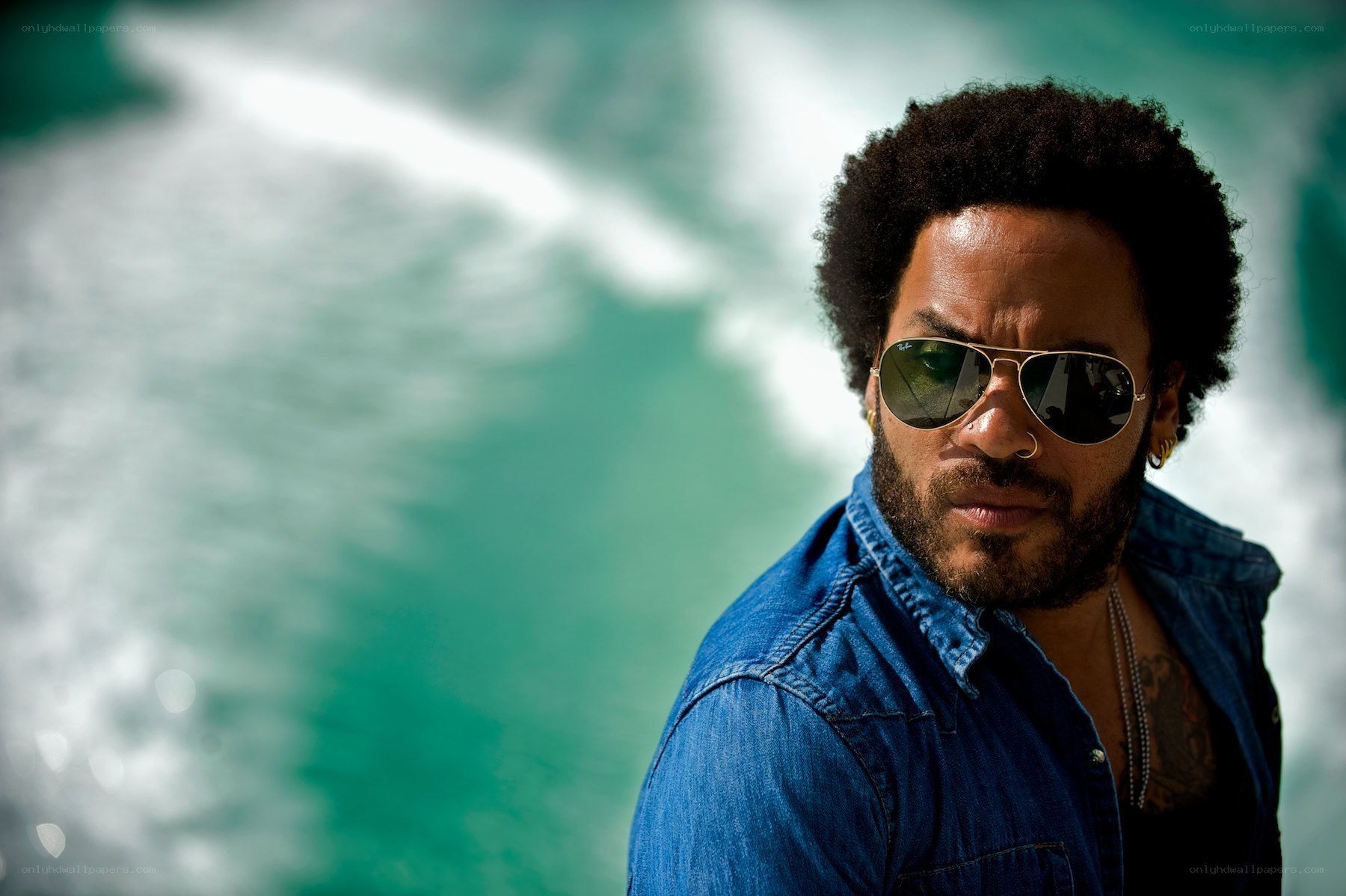 man in sunglasses by water