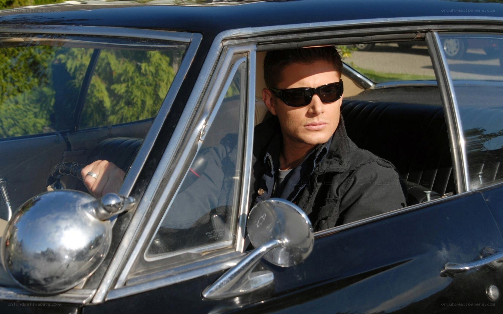 man in sunglasses driving car