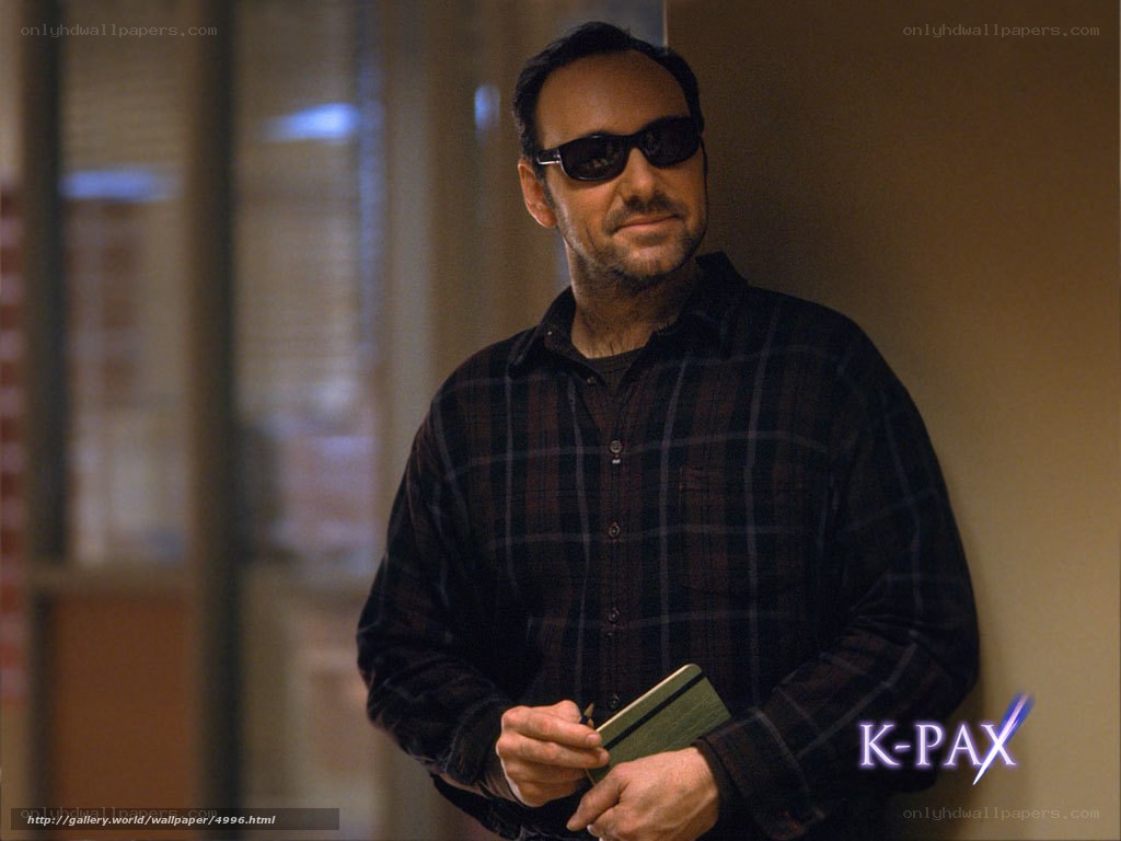 man in sunglasses holding notebook