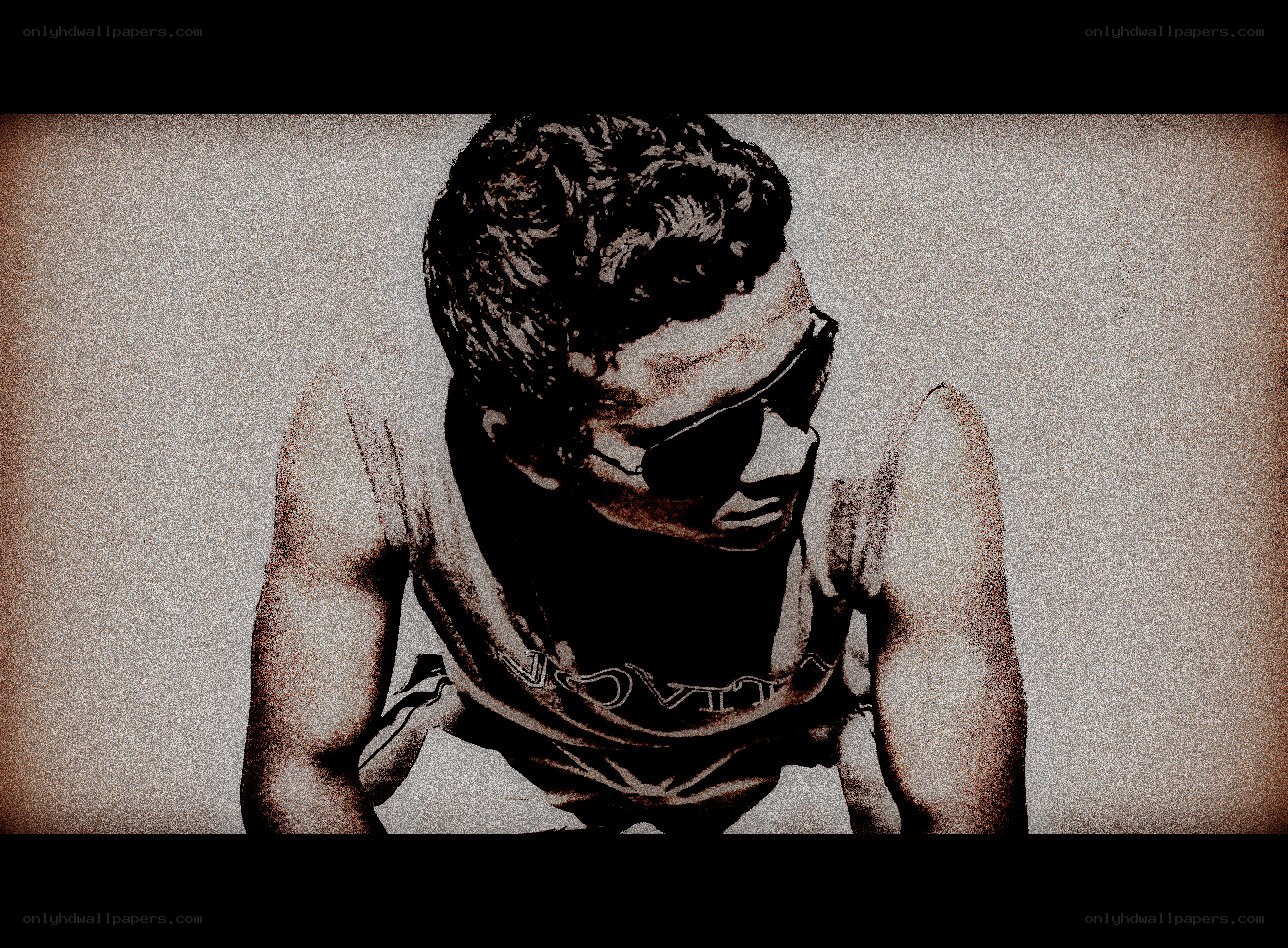 man in sunglasses looking down